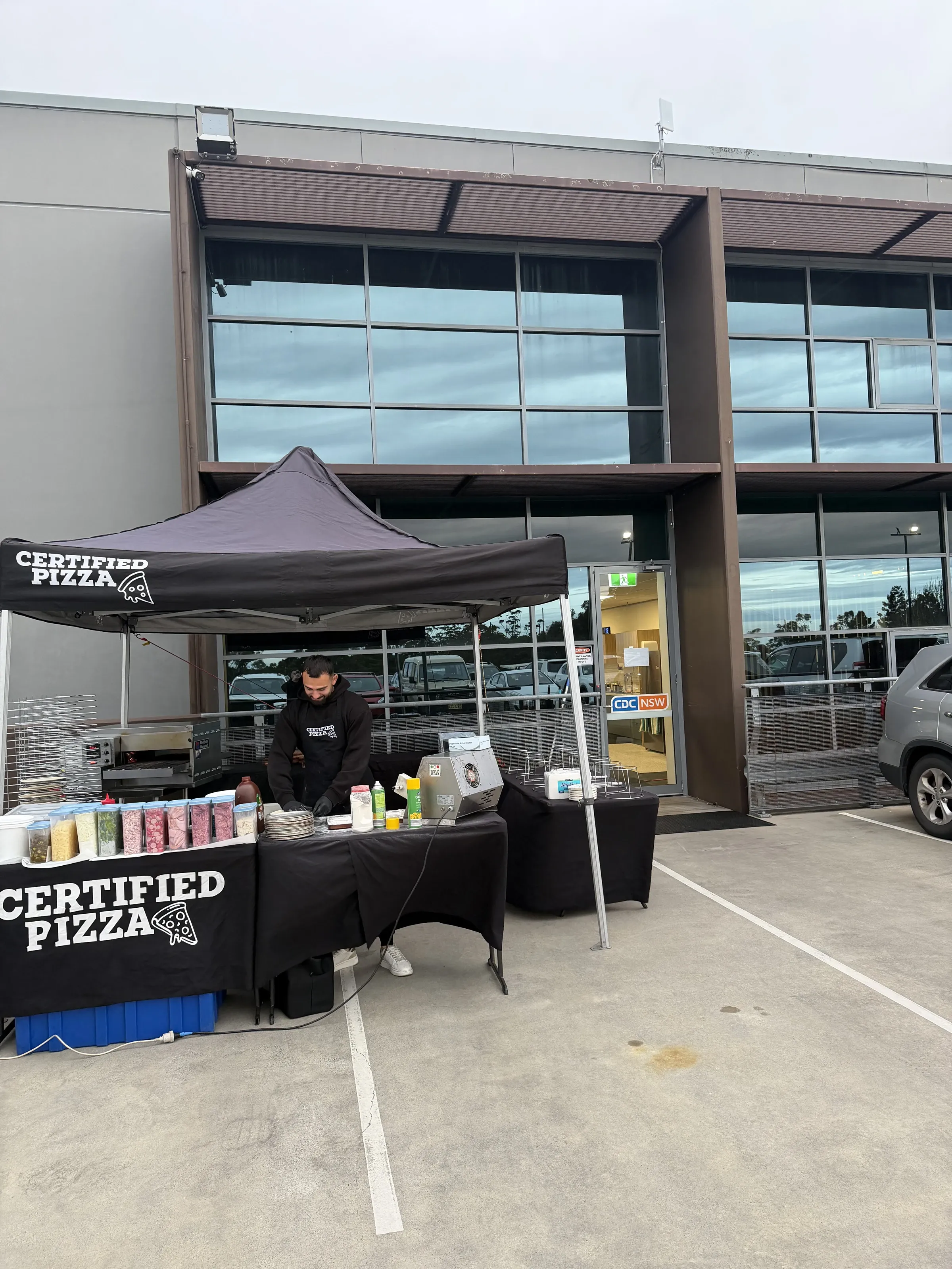 Certified Pizza branded marquee set up outside CDC NSW in Seven Hills for corporate catering