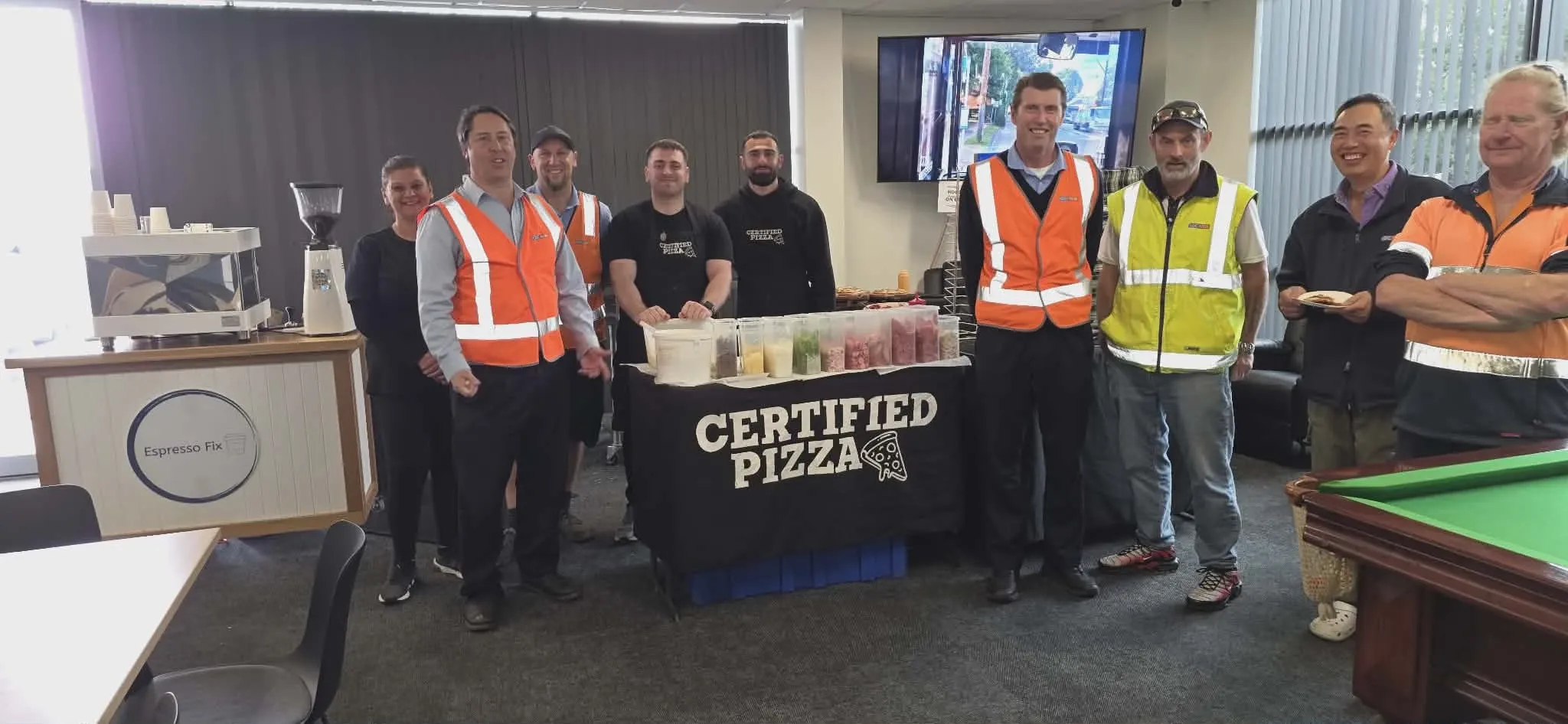 Certified Pizza team with CDC NSW staff and drivers at a corporate catering event in Seven Hills