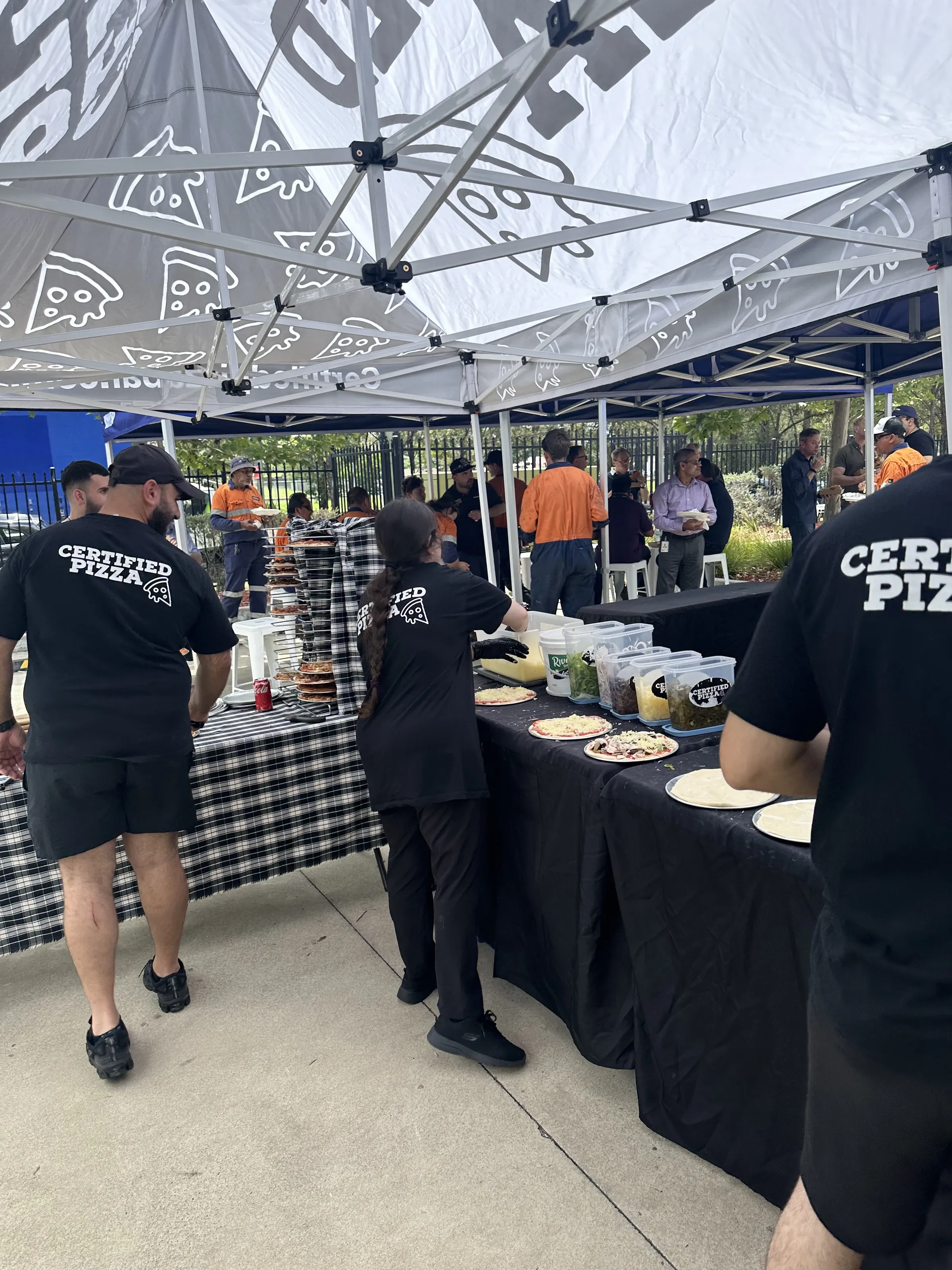 Certified Pizza service line with Komatsu staff at Fairfield corporate event