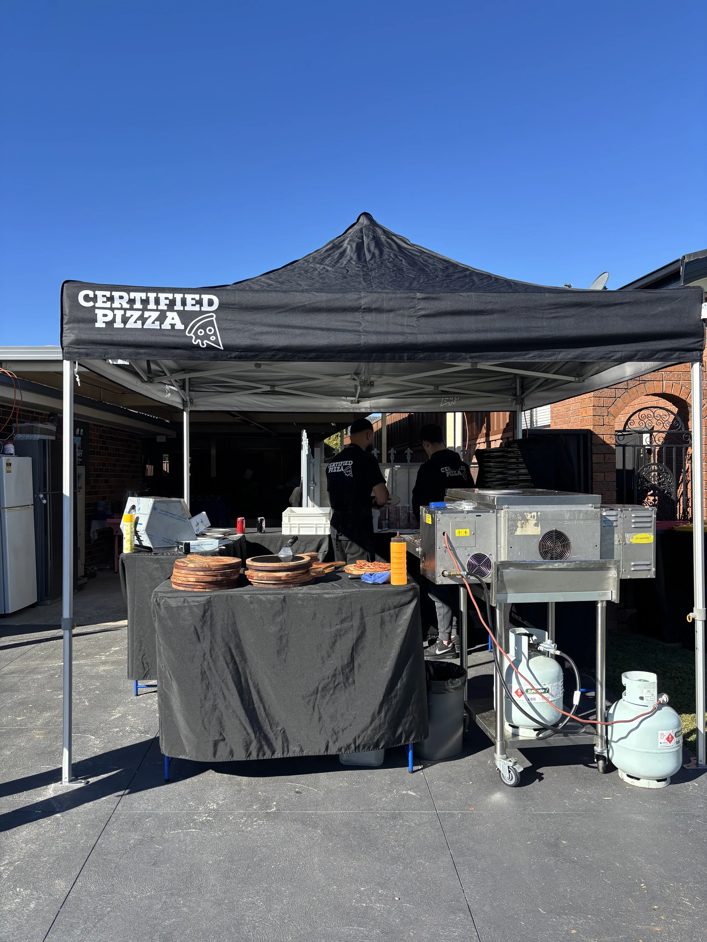 Certified Pizza branded marquee, conveyor oven and crew set up for live Sydney pizza catering