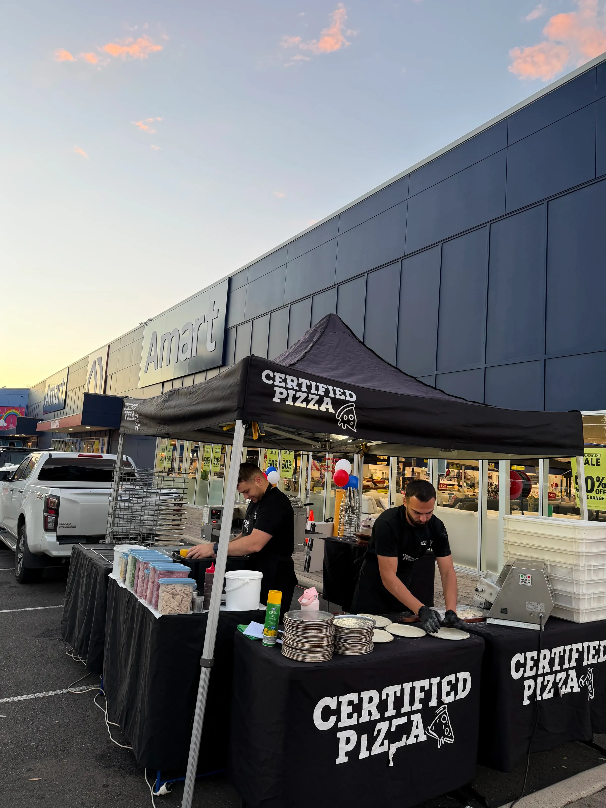 Pizzaiolo preparing pizzas live at a Sydney catering event